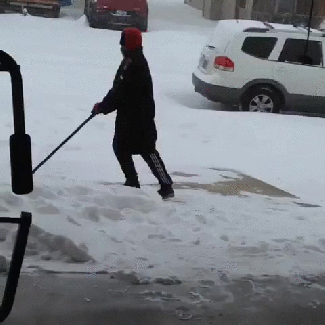 Guy falling for 9 seconds while trying to shovel snow - Imgur.gif